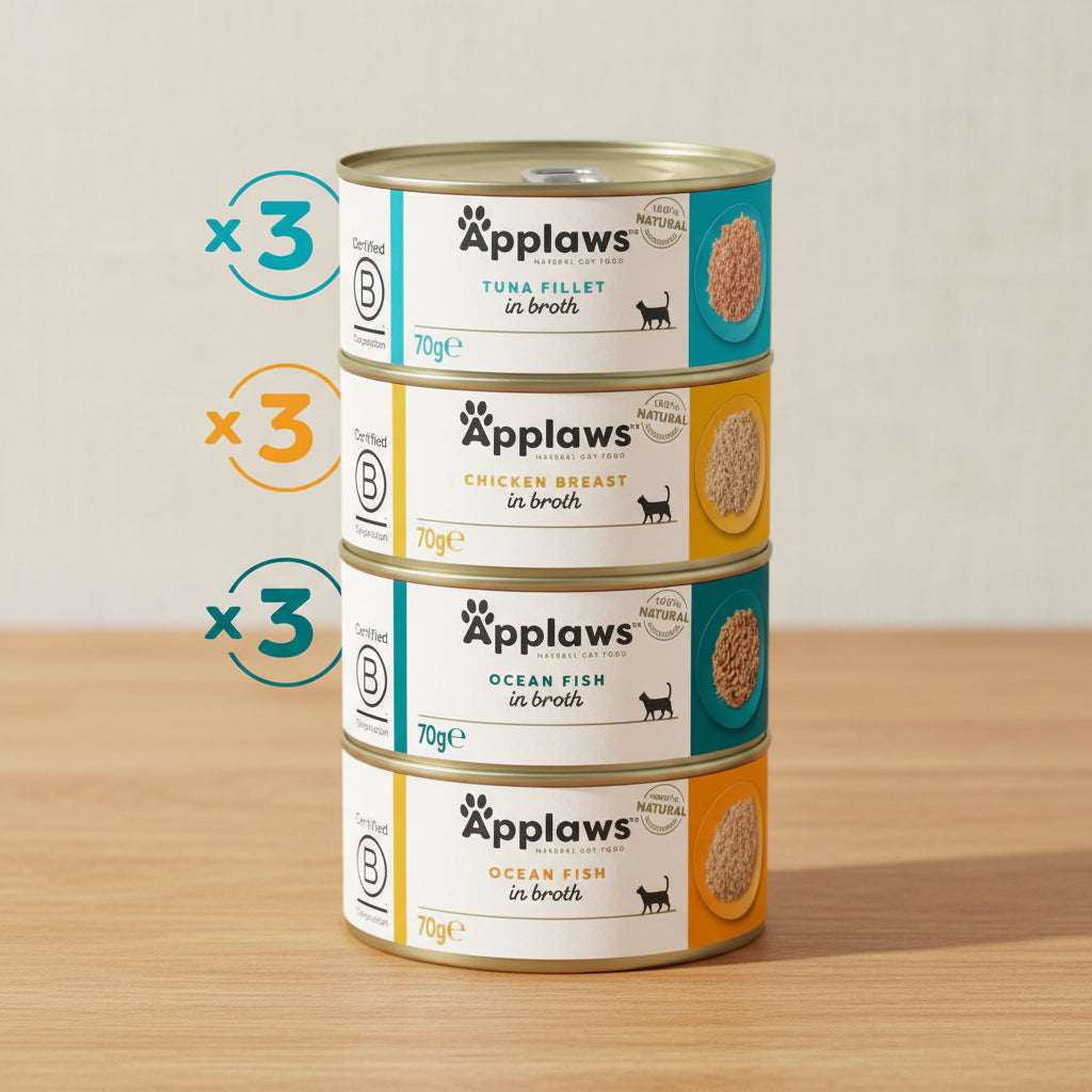 Stack of Applaws cat food tins with labels on a white background