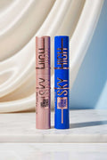 Two Maybelline New York Lash Sensational Sky High mascara tubes side by side, one in metallic rose gold and the other in metallic cobalt blue.