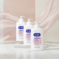 Three white pump bottles of E45 Lotion arranged in a fan shape on a plain white background. The bottles feature blue and pink labels with text indicating 24-hour moisturisation for very dry + sensitive skin.