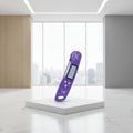 A promotional collage showing a purple refrigerator temperature monitor in use on a wall with a towel and on a refrigerator door. Text reads 'Multiple Storage Options' and highlights 'Large Hang Hole' and 'Magnetic Adsorption' with orange icons.