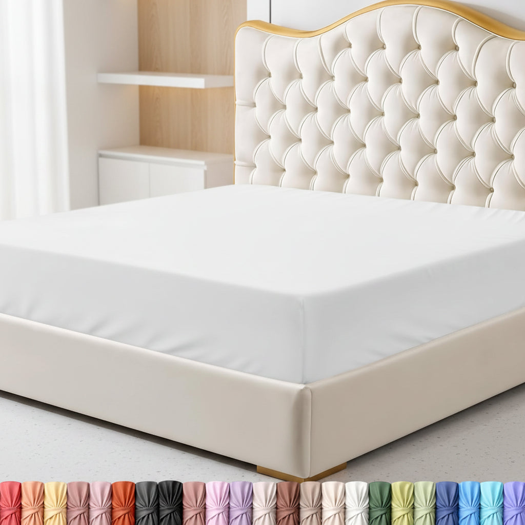 Bed with white mattress cover and decorative headboard in a bedroom setting.