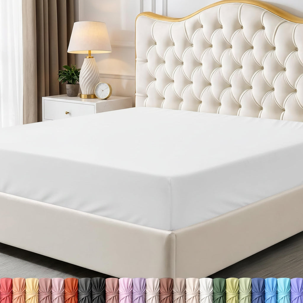 Bed with white mattress cover and decorative headboard in a bedroom setting.