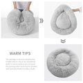 Three-panel product collage showing a fluffy light gray circular pet bed or cushion in different views, with hands demonstrating shape and a text panel explaining the package is vacuum compressed and should be shaken out of its compressed state.