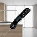 Digital thermometer with labeled features on a white background
