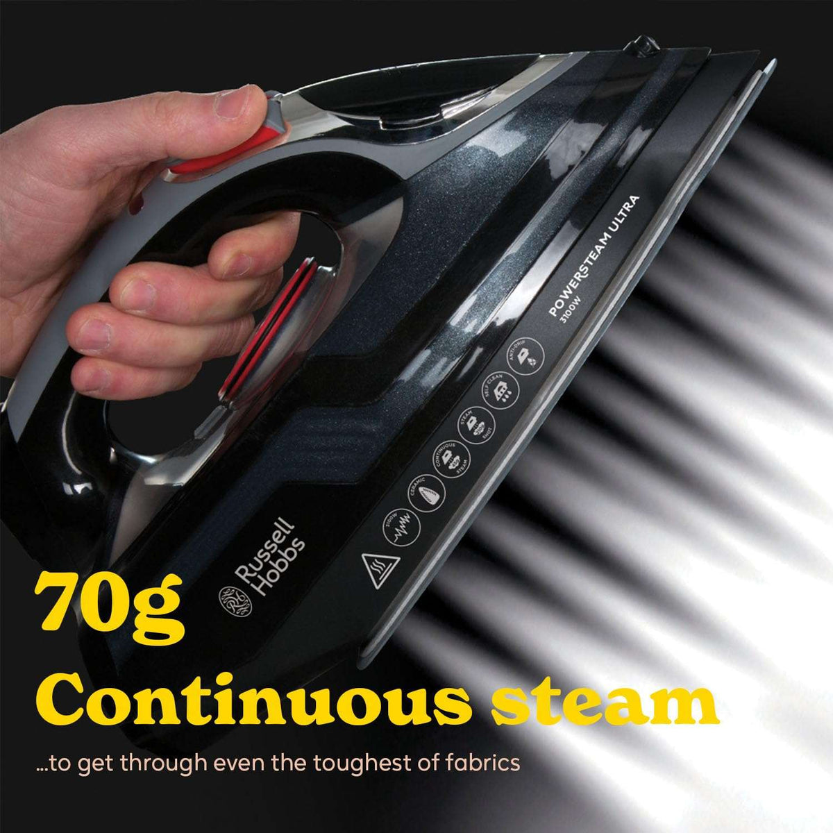 Hand holding a Russell Hobbs iron with steam output, on a black background.