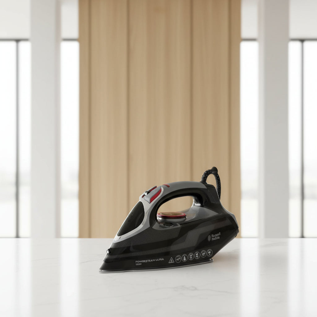 Black steam iron with red accents on a white background