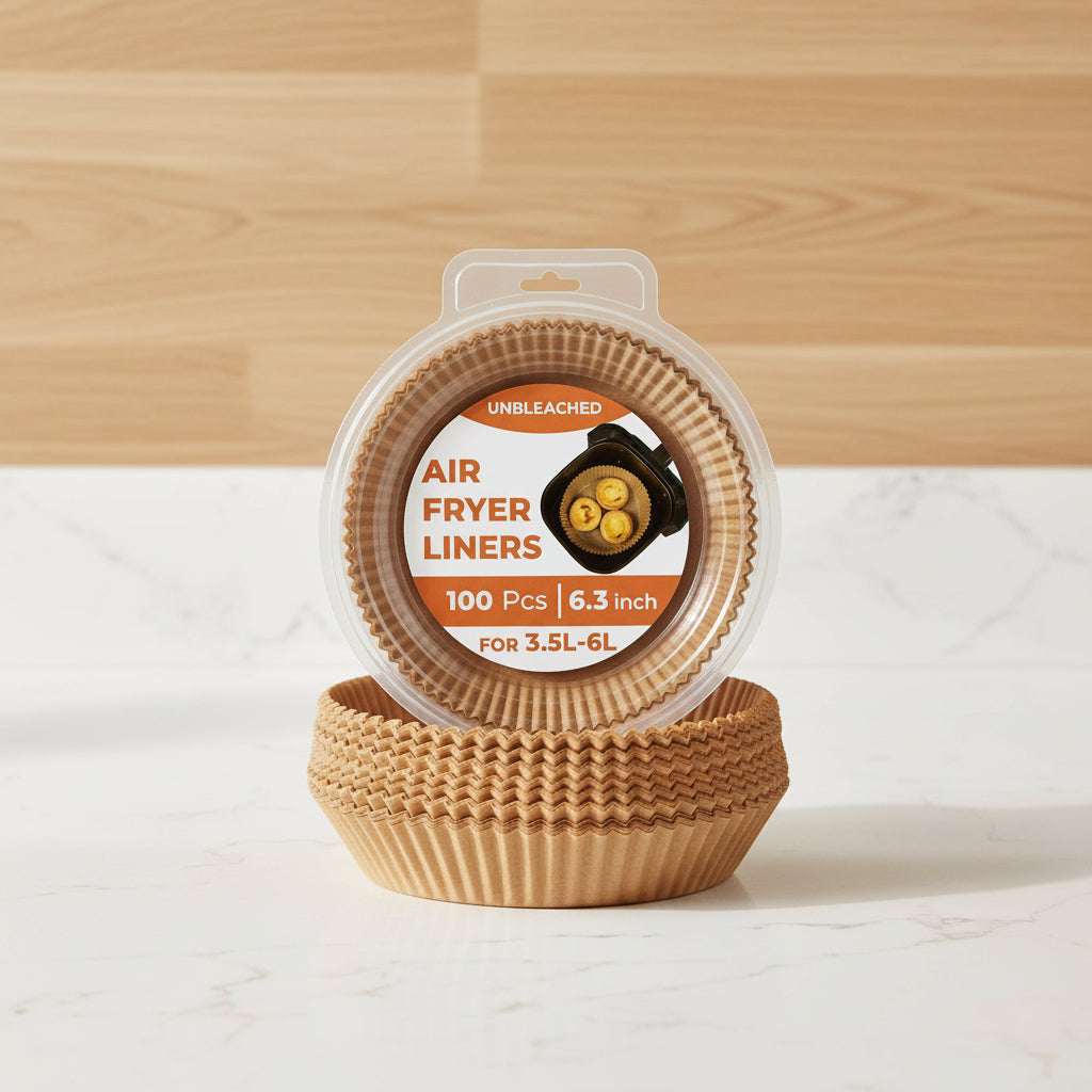Air fryer liners packaging with examples of food cooked on them.