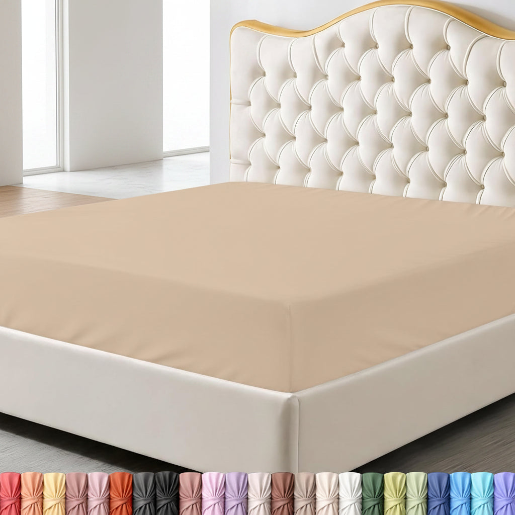 Beige fitted sheet on a bed with a decorative headboard and nightstand in a bedroom setting.
