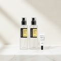 Two bottles and a tube of COSRX skincare products on a white background