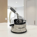 Anysharp kitchen knife sharpening system with a marble-patterned base, black components, and a partially sharpened stainless steel knife shown in an illustrative angled overlay on a white background.
