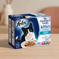 A box of Purina Felix Kitten fish selection in jelly cat food, featuring a black and white kitten on the front packaging.