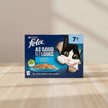 Two boxes of Felix cat food side by side. The packaging features a black and white cat peeking out of a cardboard box, with the text 'AS GOOD AS IT LOOKS' and 'Fish Selection in Jelly'.