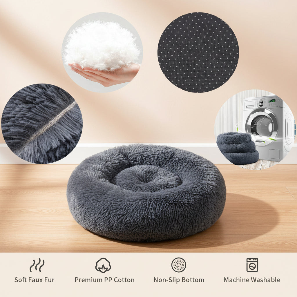 A plush round pet bed in dark charcoal gray faux fur, shown on a white background with four circular detail insets and feature icons below. The insets highlight soft white faux fur, a textured non-slip bottom, a close-up of the fluffy pile, and the bed being machine washable.