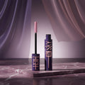 Maybelline Lash Sensational mascara with brush on a white background
