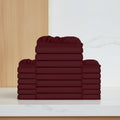 Stack of burgundy folded towels on a white background