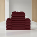 Stack of burgundy folded towels on a white background