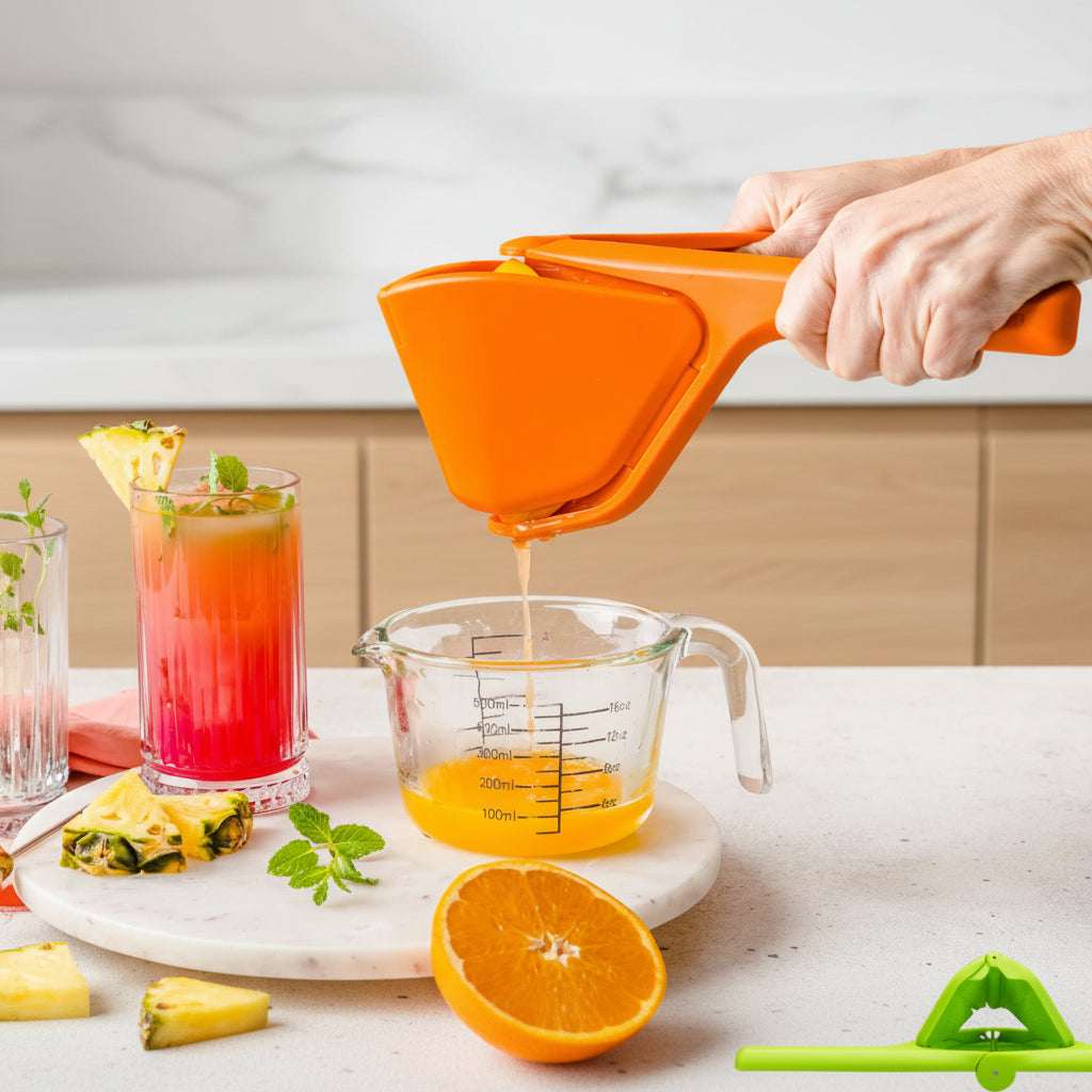 Orange juicer being used to extract juice into a measuring cup with a pink background.