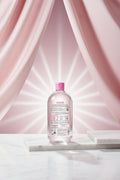 Back view of a Garnier micellar water bottle with pink cap and label.