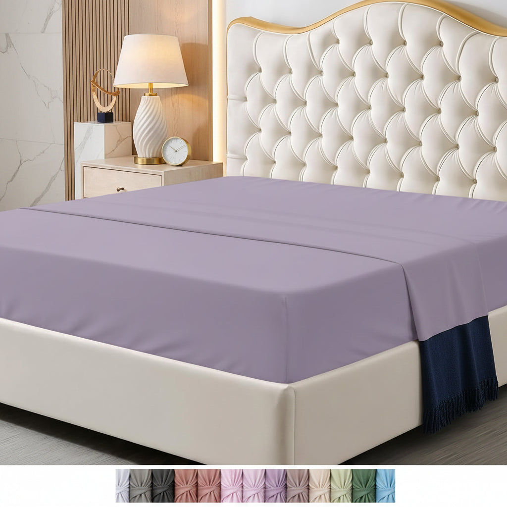 Bed with purple fitted sheet and decorative headboard in a bedroom setting.