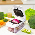 Vegetable chopper with onions and broccoli on a kitchen counter