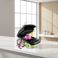 Black vegetable chopper with various attachments and chopped vegetables displayed around it, featuring the brand 'fullstar'.