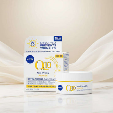 Nivea Q10 Anti-Wrinkle Power Extra Firming Day Cream SPF 30, showing the product jar in front of its retail box on a clean white background.