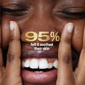 Close-up of a person's face with hands covering it, featuring text about skin soothing.