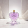 Vera Wang Princess perfume bottle surrounded by flowers and fruits