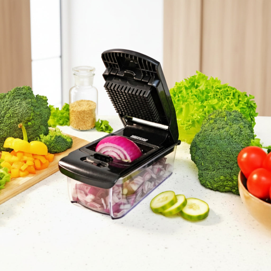 Vegetable chopper with a 1.2L family size tray on a white background with vegetables around.
