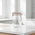 Kilner clip top jar with features listed on a teal background
