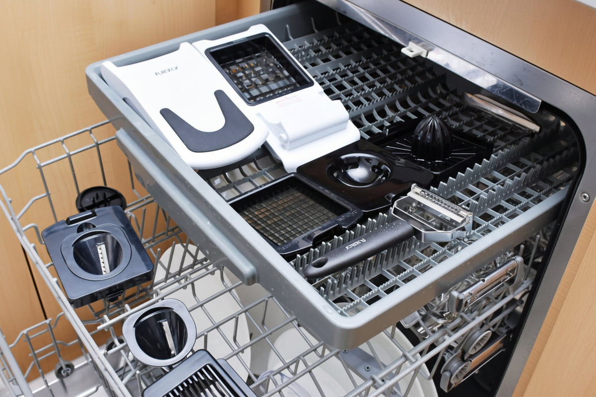 Dishwasher with various items inside, labeled 'Dishwasher Safe' and 'Just Load & Go'.