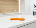 Set of kitchen utensils including spatulas and ladles in a drawer with text about space-saving design.