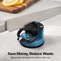 A kitchen knife being sharpened in a blue and black countertop knife sharpener, with a blurred cutting board and lemon slices in the background. Text at the bottom reads 'Save Money, Reduce Waste' and 'Rejuvenate old blades to perform like new.