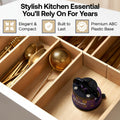 A kitchen drawer organizer set shown open, with gold utensils in compartments and a purple-and-black Sharpie-branded drawer stopper in the front compartment. Text at the top reads 'Stylish Kitchen Essential You'll Rely On For Years' with feature callouts.