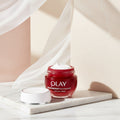 Olay Regenerist Niacinamide cream jar with a white background