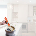 Digital thermometer being used to measure food with images of various food items and a list of measurements it can take.