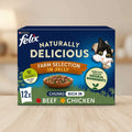 Purina Felix Naturally Delicious Farm Selection in Jelly cat food packaging, 12-pack. The box features a dark blue background with a black and white cat peeking from the top right, a bowl of wet cat food in the center, and text indicating beef and chicken flavors.