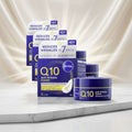 Four NIVEA Q10 Anti-Wrinkle Power Regenerating Night Cream jars and cartons arranged on a plain white background. The packaging is primarily deep blue and white with yellow text and accents, and the cream jars are dark blue with yellow bands.