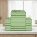 Stack of green fitted sheets on a white background