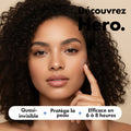 Woman pointing to a blemish on her face with text about a skincare product.