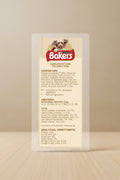 A tall blue package panel for Petition Bakers Complete Pet Food for Adult Dogs, showing a dog photo at the top and detailed nutritional and compositional text in white and red on a blue background.