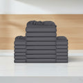Stack of gray fitted sheets on a white background