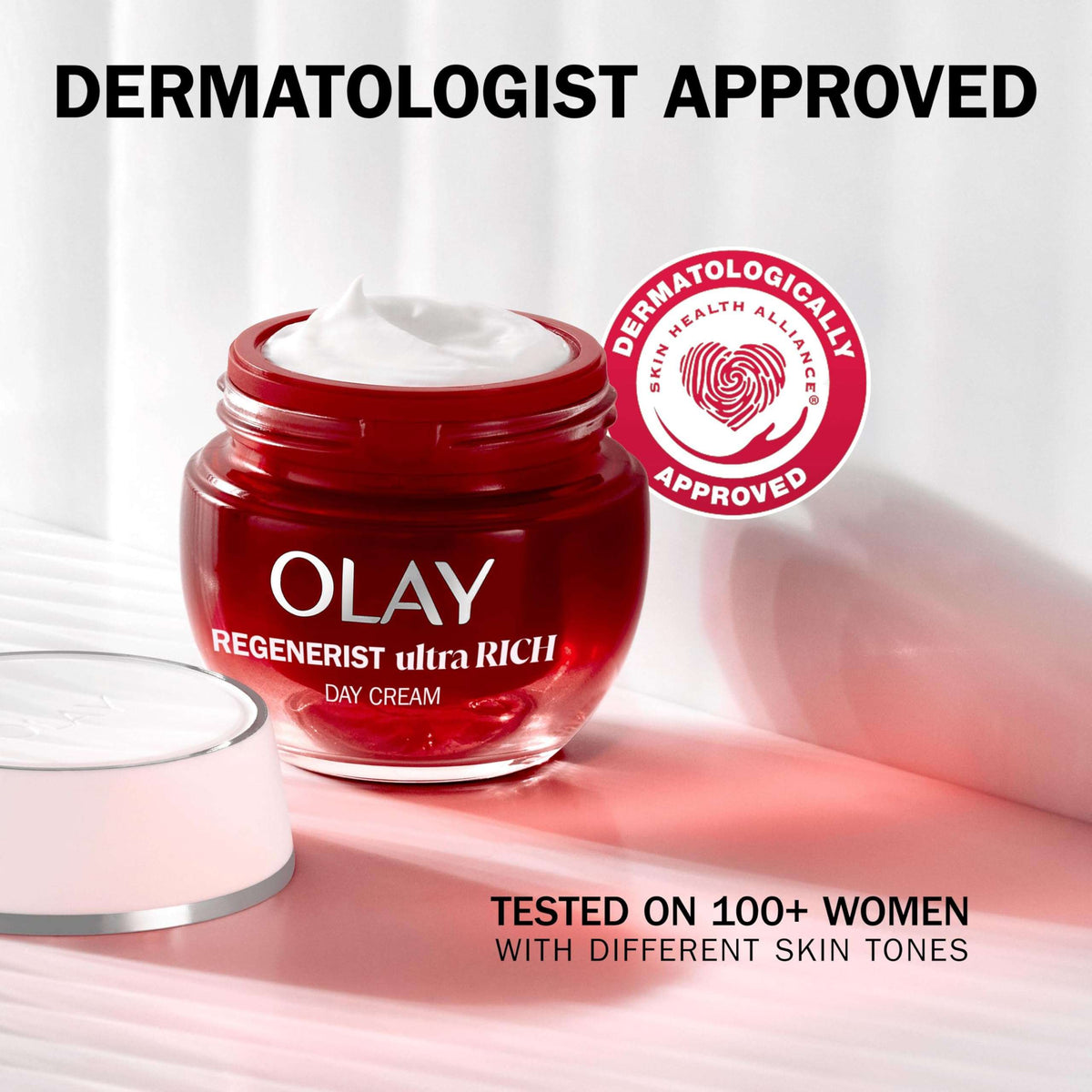 Red Olay Regenerist ultra RICH day cream jar with a white cap on a light background, featuring 'Dermatologist Approved' label.