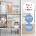 Kitchen shelving unit with glass jars storing dried food, labeled 'Store Style Create'.