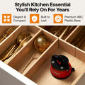 Red sharpie in a wooden drawer with gold utensils, labeled as a stylish kitchen essential.