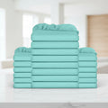 A stack of folded sheets in a solid mint green or aqua color, arranged symmetrically with one tall central stack and two shorter stacks on each side, isolated on a white background.
