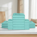 A stack of folded sheets in a solid mint green or aqua color, arranged symmetrically with one tall central stack and two shorter stacks on each side, isolated on a white background.