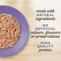 Purple plate with shredded meat and text about natural ingredients and high quality protein.