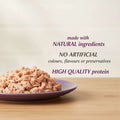 Purple plate with shredded meat and text about natural ingredients and high quality protein.