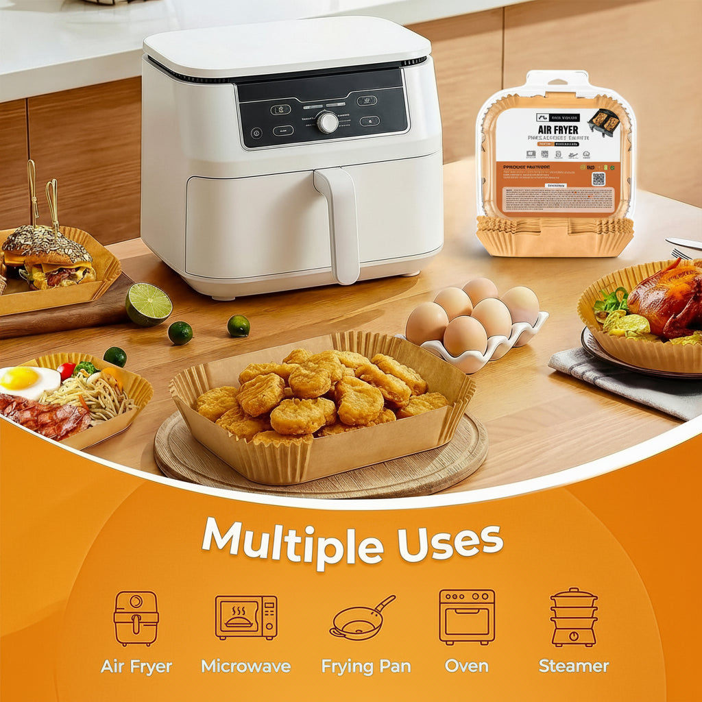 A white air fryer shown on a kitchen countertop with food items around it, plus a packaged version of the same air fryer and an orange promotional banner at the bottom listing multiple uses including air fryer, microwave, frying pan, oven, and steamer.